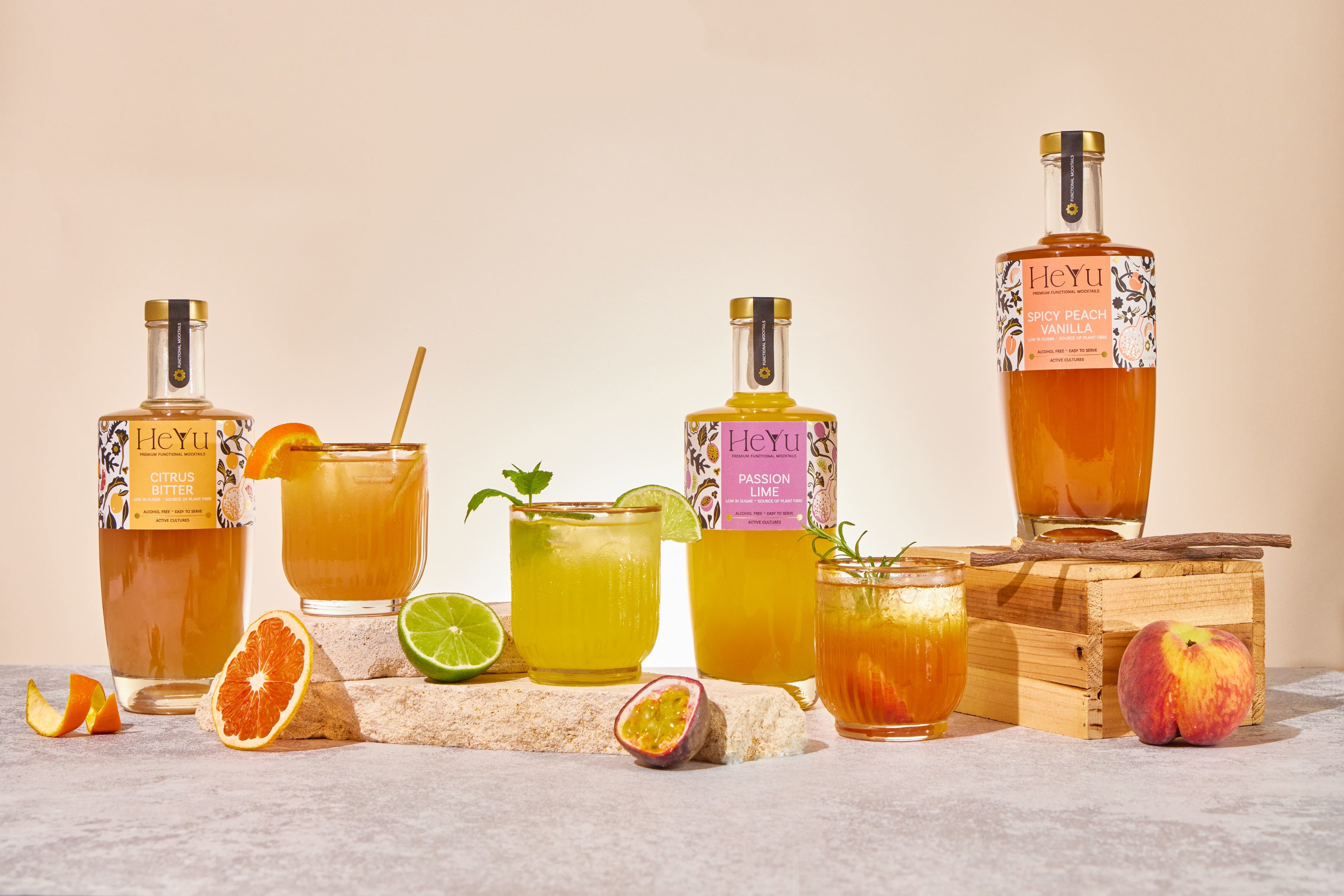 Overview picture of all three flavors of Heyu giftsets is displayed in the background with glasses of how to serve the mocktails.